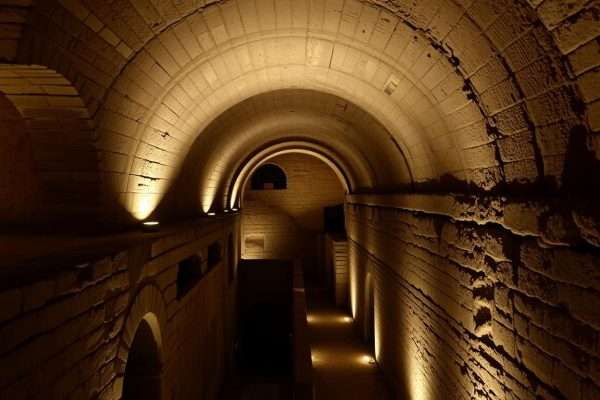 Underground ancient ruins at San Clemente Basilica in Rome with atmospheric lighting Underground ancient ruins at San Clemente Basilica in Rome with atmospheric lighting