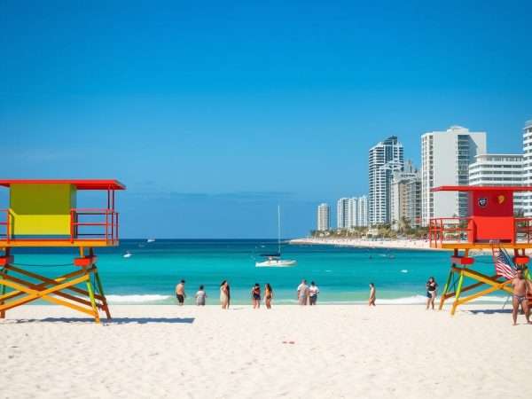 South Beach Miami with colorful lifeguard towers and warm December sunshine