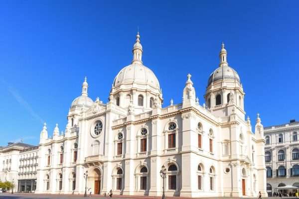 The Almudena Cathedral in Madrid with its neo-Gothic facade next to the Royal Palace The Almudena Cathedral in Madrid with its neo-Gothic facade next to the Royal Palace