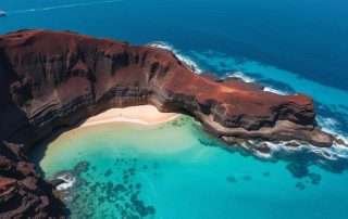 Aerial view of Halona Beach Cove on Oahu showing turquoise waters surrounded by volcanic rock formations