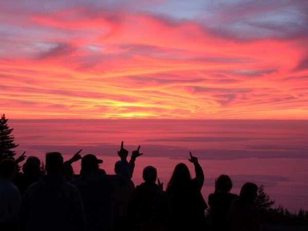 People enjoying a sunset over Lake Superior in Duluth People enjoying a sunset over Lake Superior in Duluth