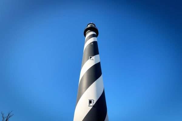 St. Augustine Lighthouse standing tall against a blue sky St. Augustine Lighthouse standing tall against a blue sky