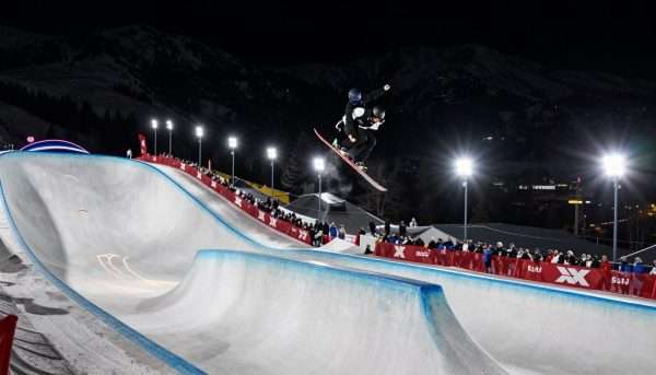 Nighttime SuperPipe competition at Winter X Games 2026 locations with dramatic lighting Nighttime SuperPipe competition at Winter X Games 2026 locations with dramatic lighting