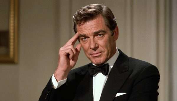 Roger Moore as James Bond raising an eyebrow after delivering a double entendre Roger Moore as James Bond raising an eyebrow after delivering a double entendre