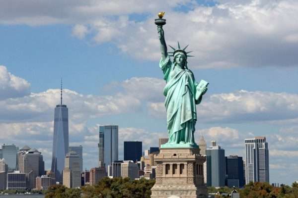 Statue of Liberty against New York skyline, a UNESCO site in USA