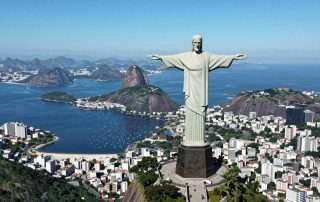Aerial view of Rio de Janeiro with Christ the Redeemer statue overlooking the city and beaches - Brazil Travel Guide