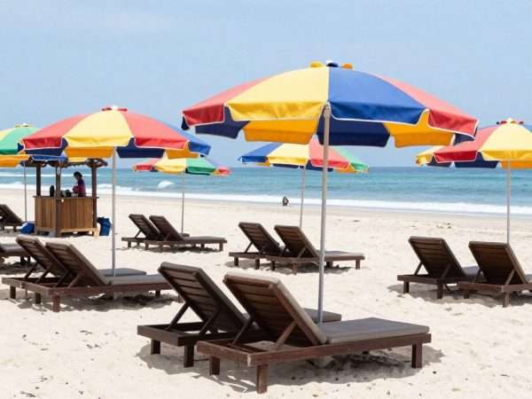 Beach loungers and umbrellas available for rent at Geger Beach Beach loungers and umbrellas available for rent at Geger Beach
