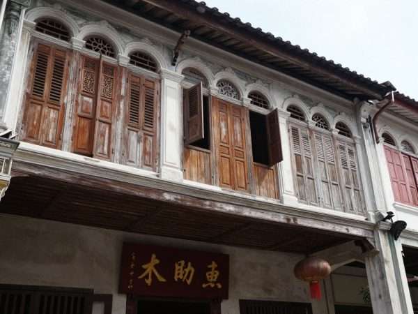 Close-up of traditional Sino-Portuguese shophouses in Koh Lanta Old Town showing architectural details Close-up of traditional Sino-Portuguese shophouses in Koh Lanta Old Town showing architectural details