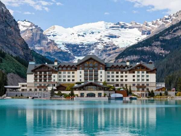 Fairmont Chateau Lake Louise resort with emerald lake and mountain views Fairmont Chateau Lake Louise resort with emerald lake and mountain views