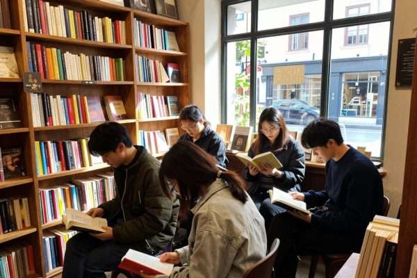 Group visiting independent bookstore on retreat excursion Group visiting independent bookstore on retreat excursion