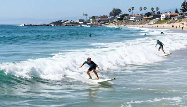 Advanced surfers at Malibu point break with perfect waves Advanced surfers at Malibu point break with perfect waves