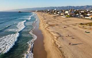 Aerial view of beaches in Los Angeles coastline with golden sand and Pacific Ocean waves