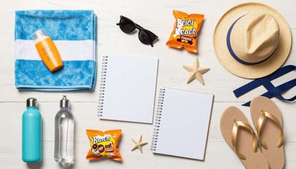 Beach planning checklist with sunscreen, towels, and beach gear Beach planning checklist with sunscreen, towels, and beach gear