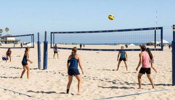 Beach volleyball courts at Manhattan Beach with players competing Beach volleyball courts at Manhattan Beach with players competing