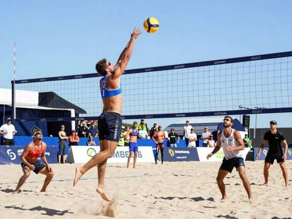 Competitive beach volleyball game on LA sand court Competitive beach volleyball game on LA sand court