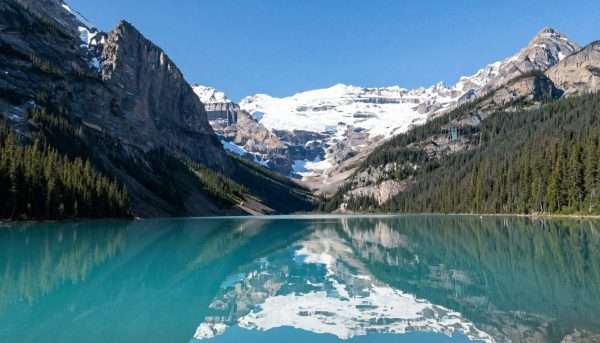 Lake Louise in Banff National Park with turquoise waters and snow-capped peaks Lake Louise in Banff National Park with turquoise waters and snow-capped peaks