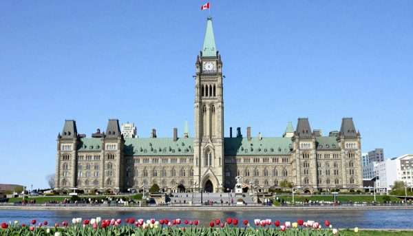 Parliament Buildings in Ottawa with Rideau Canal in foreground Parliament Buildings in Ottawa with Rideau Canal in foreground