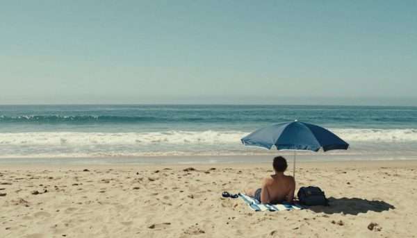 Peaceful beach scene with person relaxing and enjoying ocean views Peaceful beach scene with person relaxing and enjoying ocean views