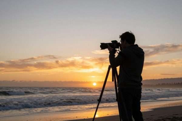 Photographer capturing sunset at LA beach Photographer capturing sunset at LA beach