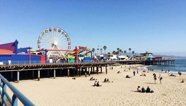 Santa Monica Pier with ferris wheel overlooking Santa Monica Beach and Pacific Ocean Santa Monica Pier with ferris wheel overlooking Santa Monica Beach and Pacific Ocean
