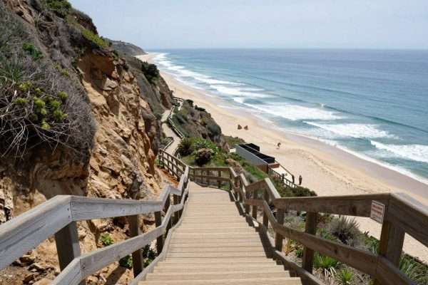 Steep wooden staircase leading down to El Matador Beach Steep wooden staircase leading down to El Matador Beach