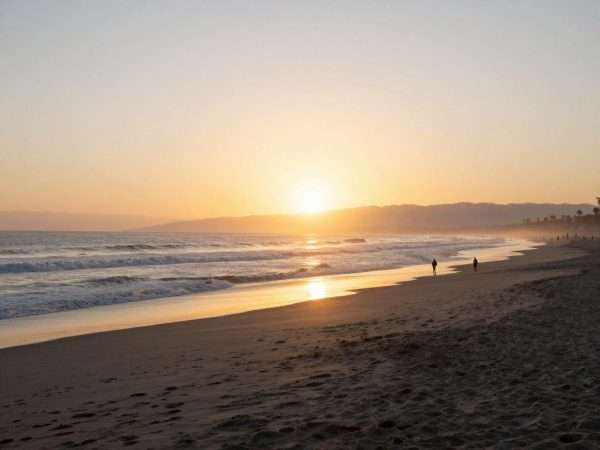 Sunrise over LA beach with few people and peaceful atmosphere Sunrise over LA beach with few people and peaceful atmosphere