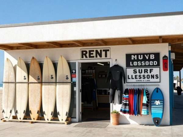 Surf shop with rental boards and wetsuits displayed Surf shop with rental boards and wetsuits displayed
