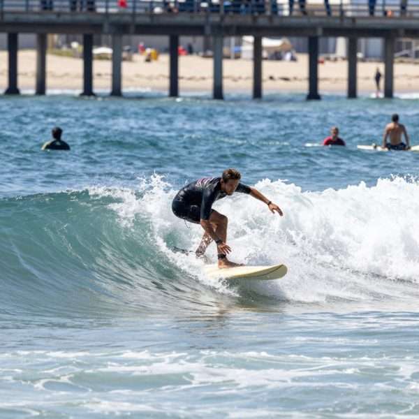 Surfers riding waves at Manhattan Beach Surfers riding waves at Manhattan Beach