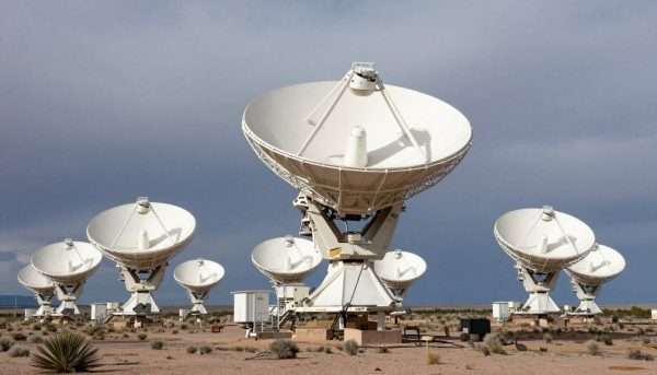 Very Large Array radio telescope dishes arranged across New Mexico desert plains Very Large Array radio telescope dishes arranged across New Mexico desert plains