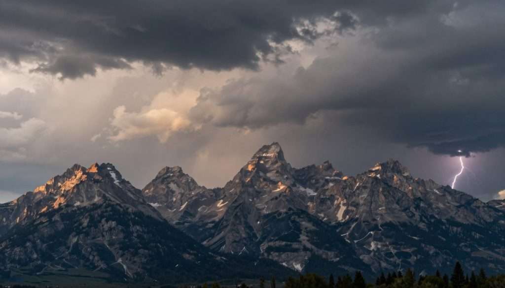 Dramatic weather over Grand Teton mountains with storm clouds Dramatic weather over Grand Teton mountains with storm clouds