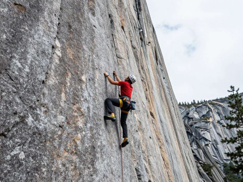 Rock climbers on Yosemite granite wall with climbing gear Rock climbers on Yosemite granite wall with climbing gear